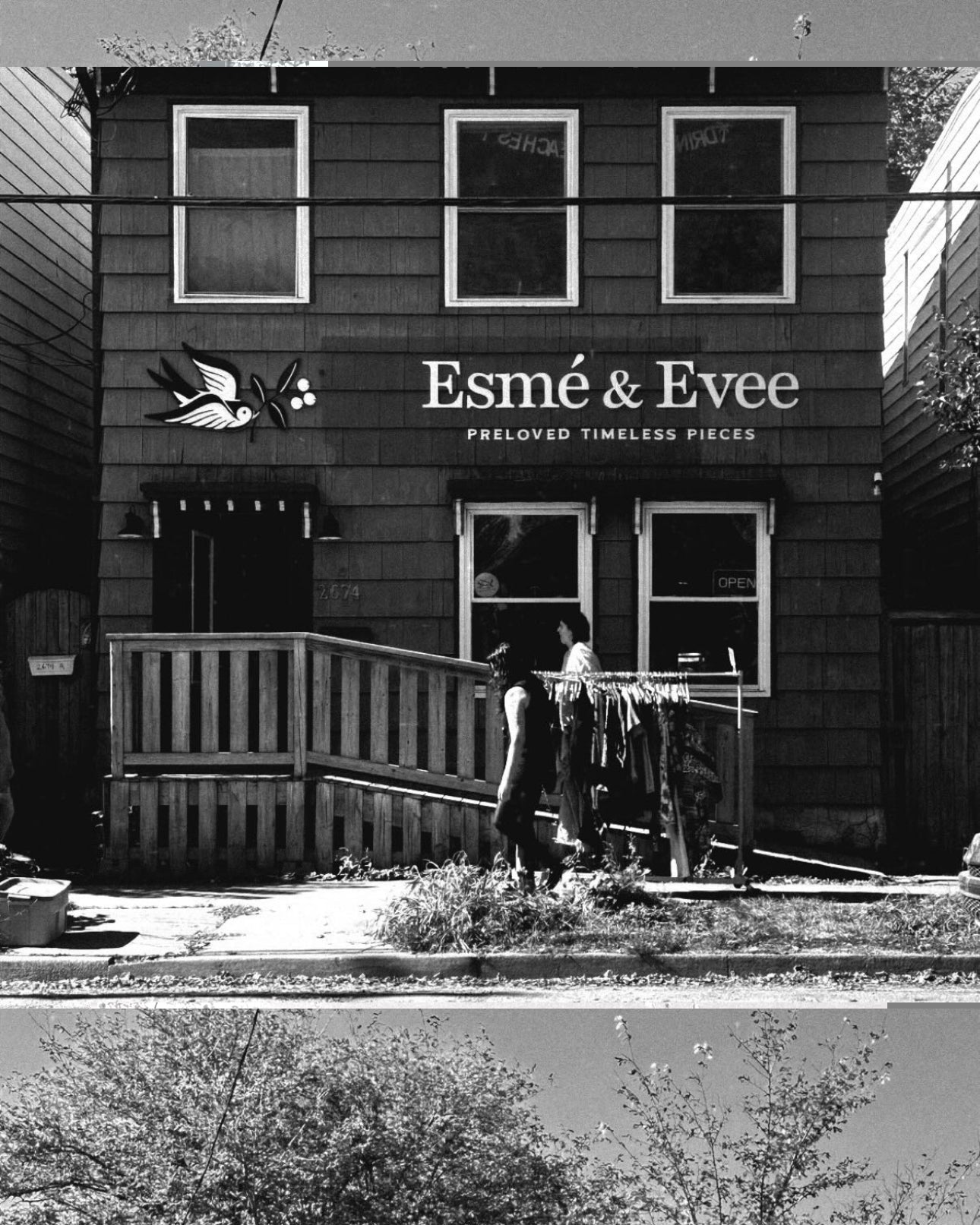 Black and white photo of a store front with 'Esmé & Evee' branding.